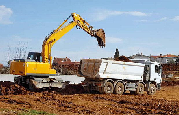 Removing waste from a construction site